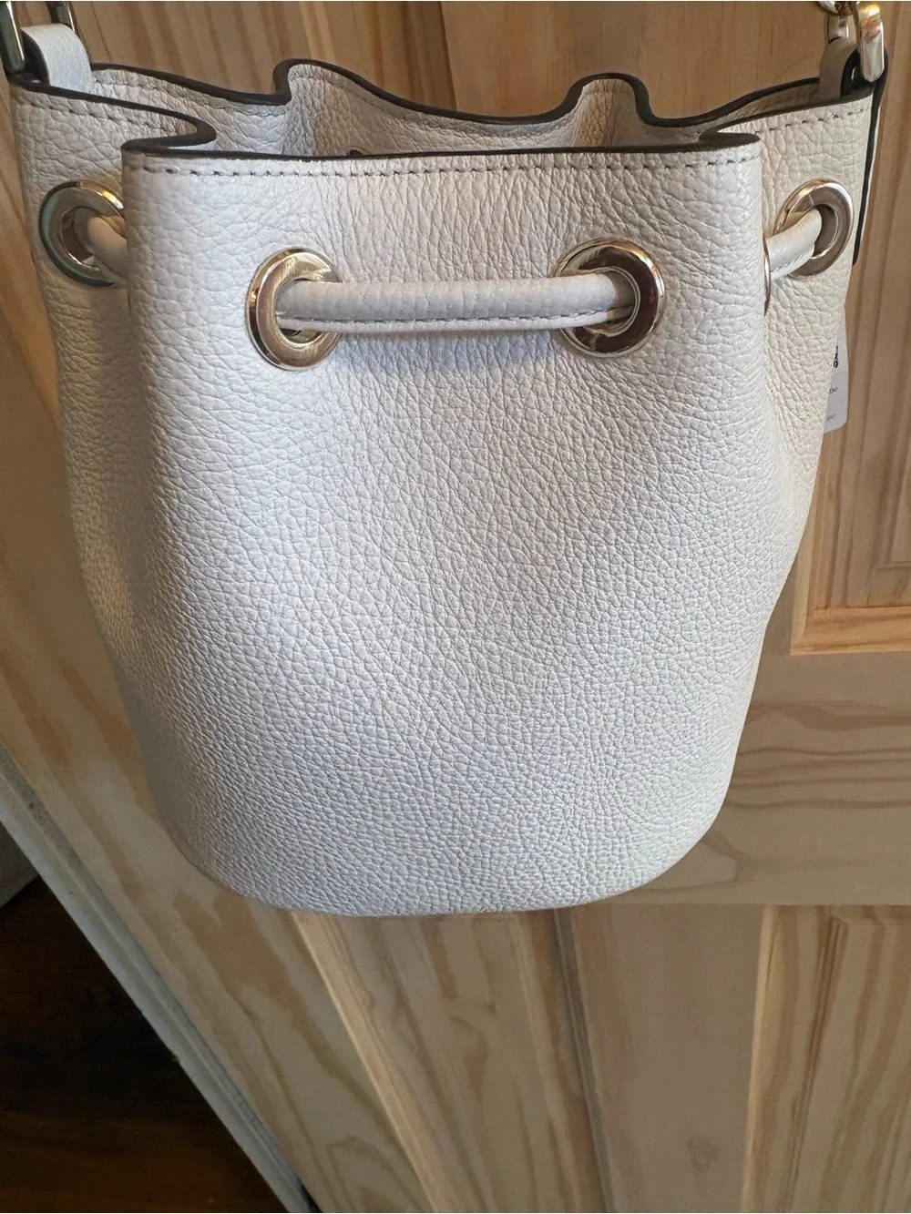 kate spade Cream Pebbled Leather Drawstring Crossbody with Striped Strap